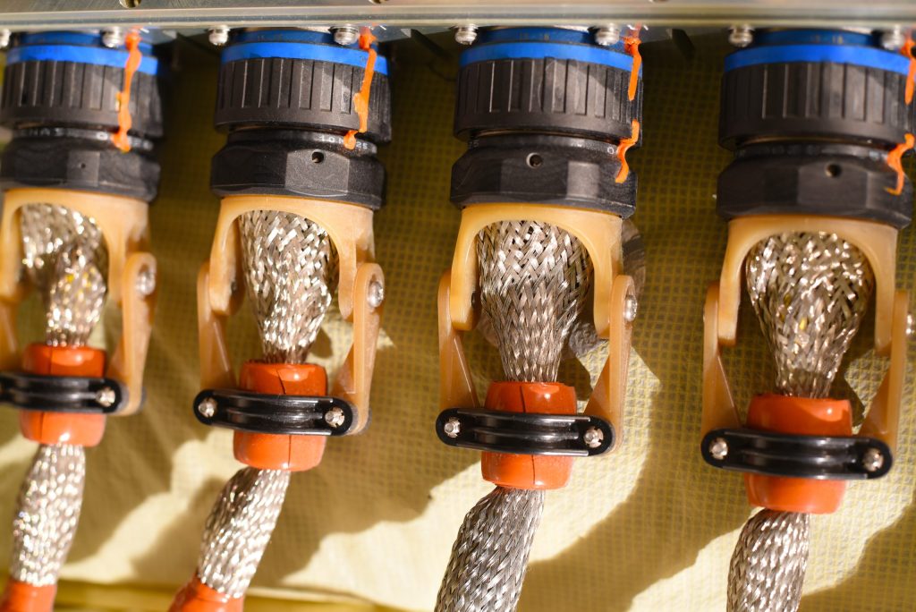 A Row Of Four Aircraft Electrical Connectors Canon Plugs.